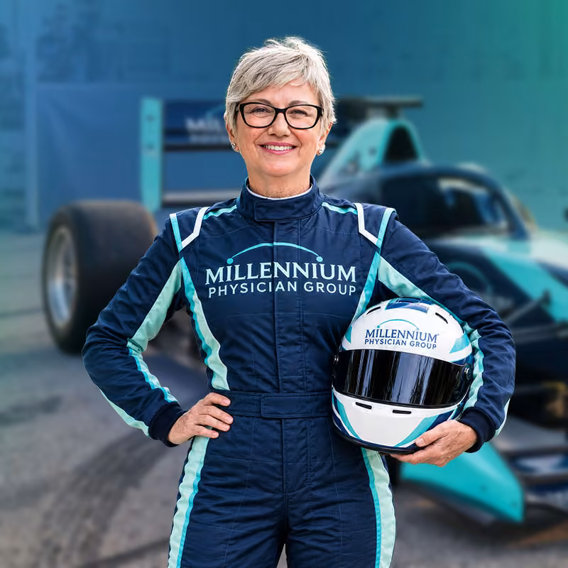 Millennium Physician Group brand ambassador in a racing suit, used as the AEP 2027 landing page thumbnail